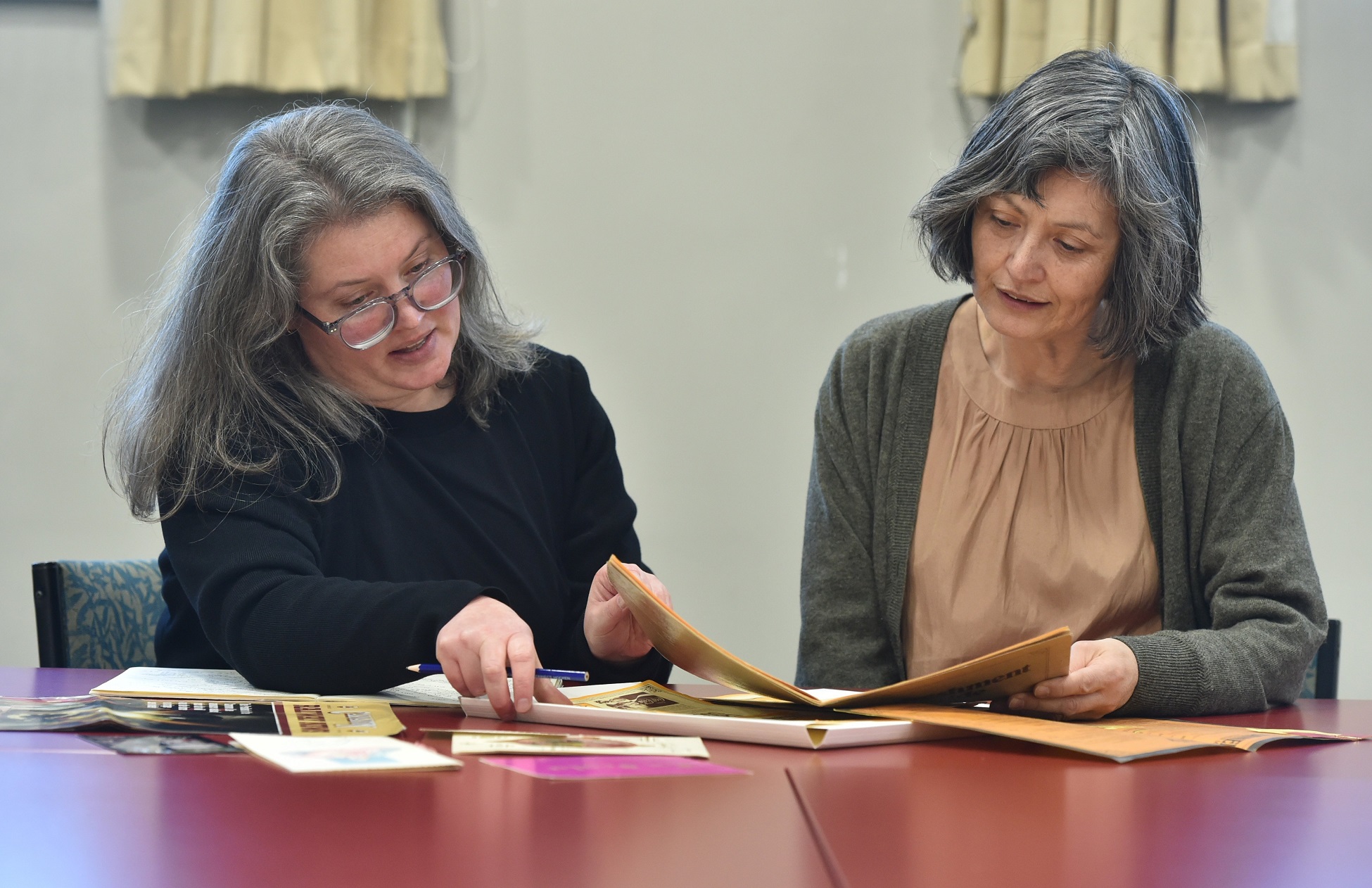 Emily Duncan (left) researches  with Katherine Milburn at the Hocken Library in Dunedin. Photo:...