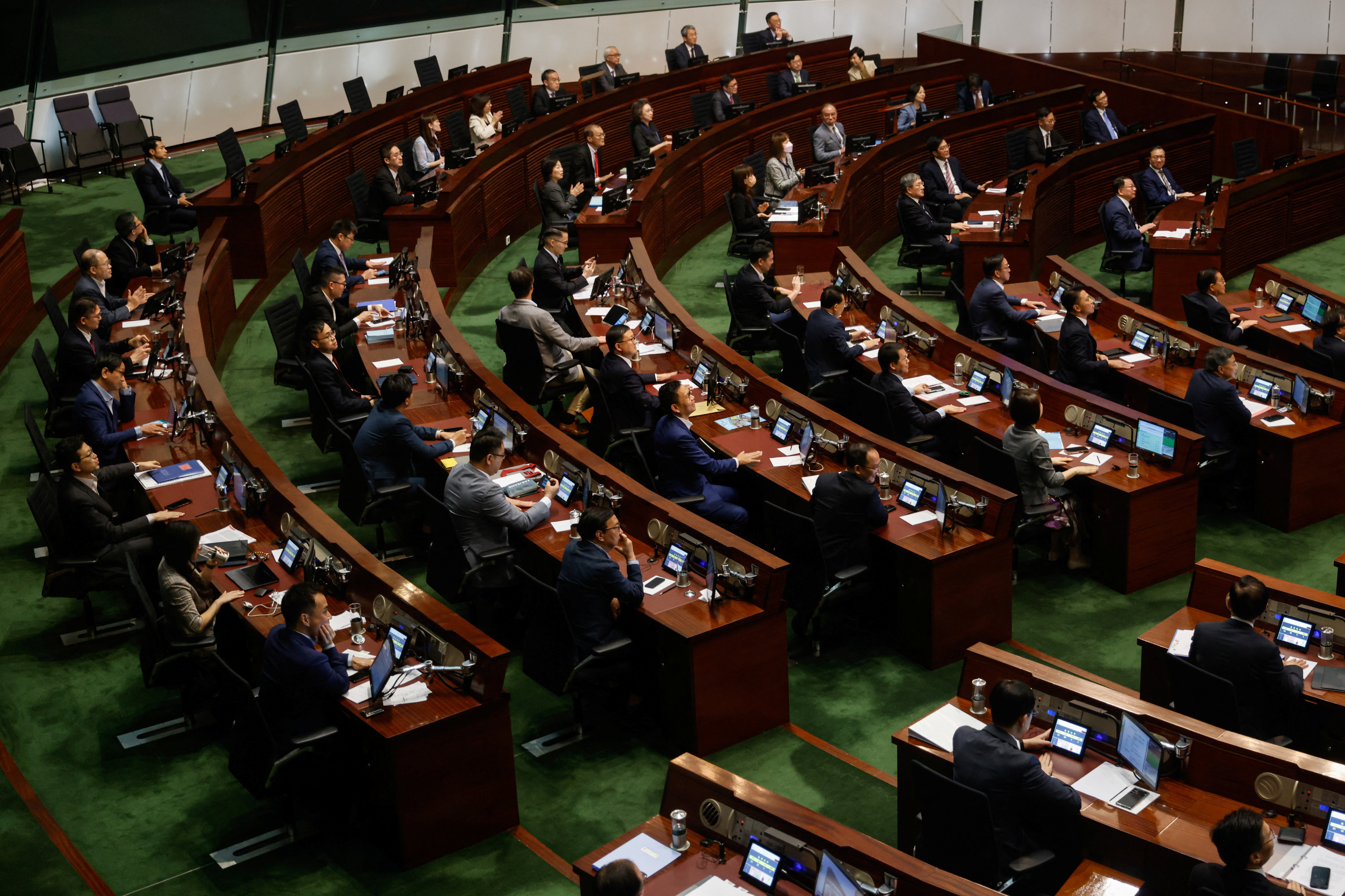 Hong Kong's legislature voted on Thursday to overhaul district level elections by drastically...
