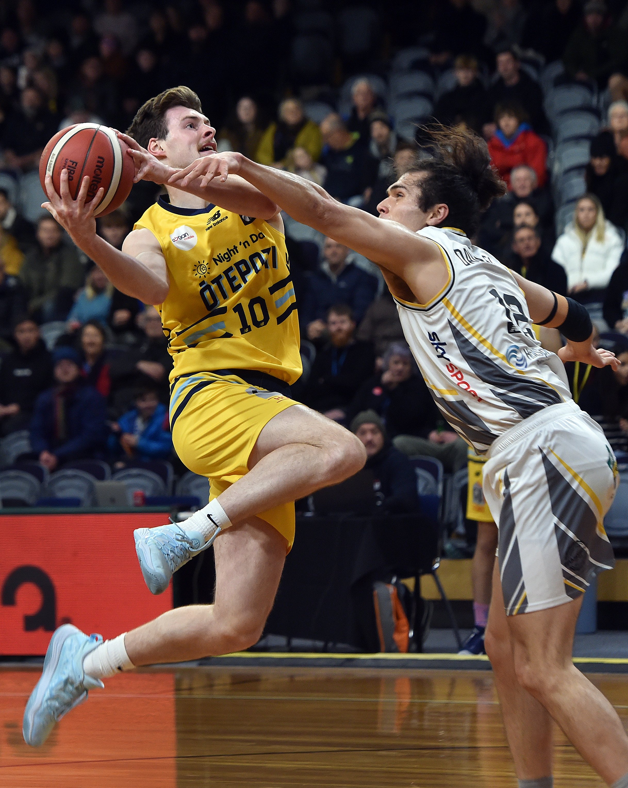 Nuggets shooting guard Michael Harris drives to the basket while being defended by Bulls forward...