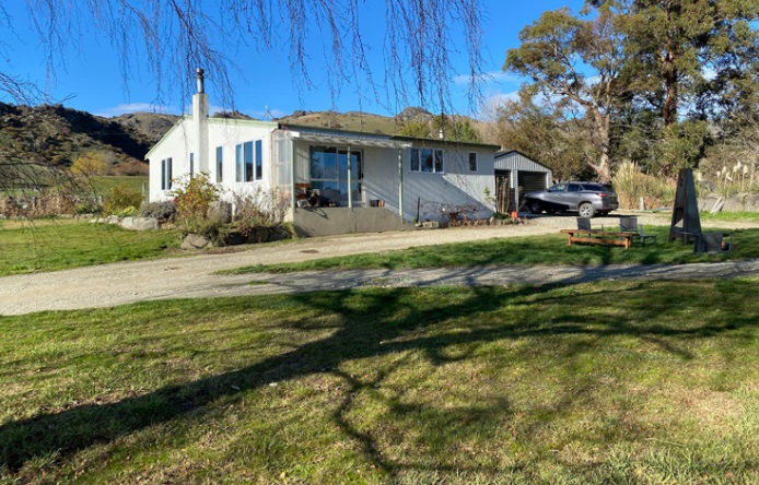 The land comes with a modest three-bedroom cottage. Photo: Supplied