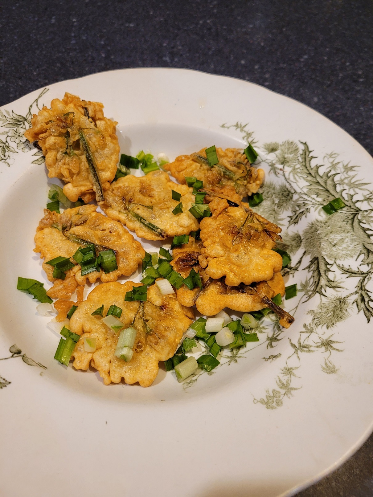 The flower heads, dipped in batter, make an oniony fritter. Photos: Hilary Rowley