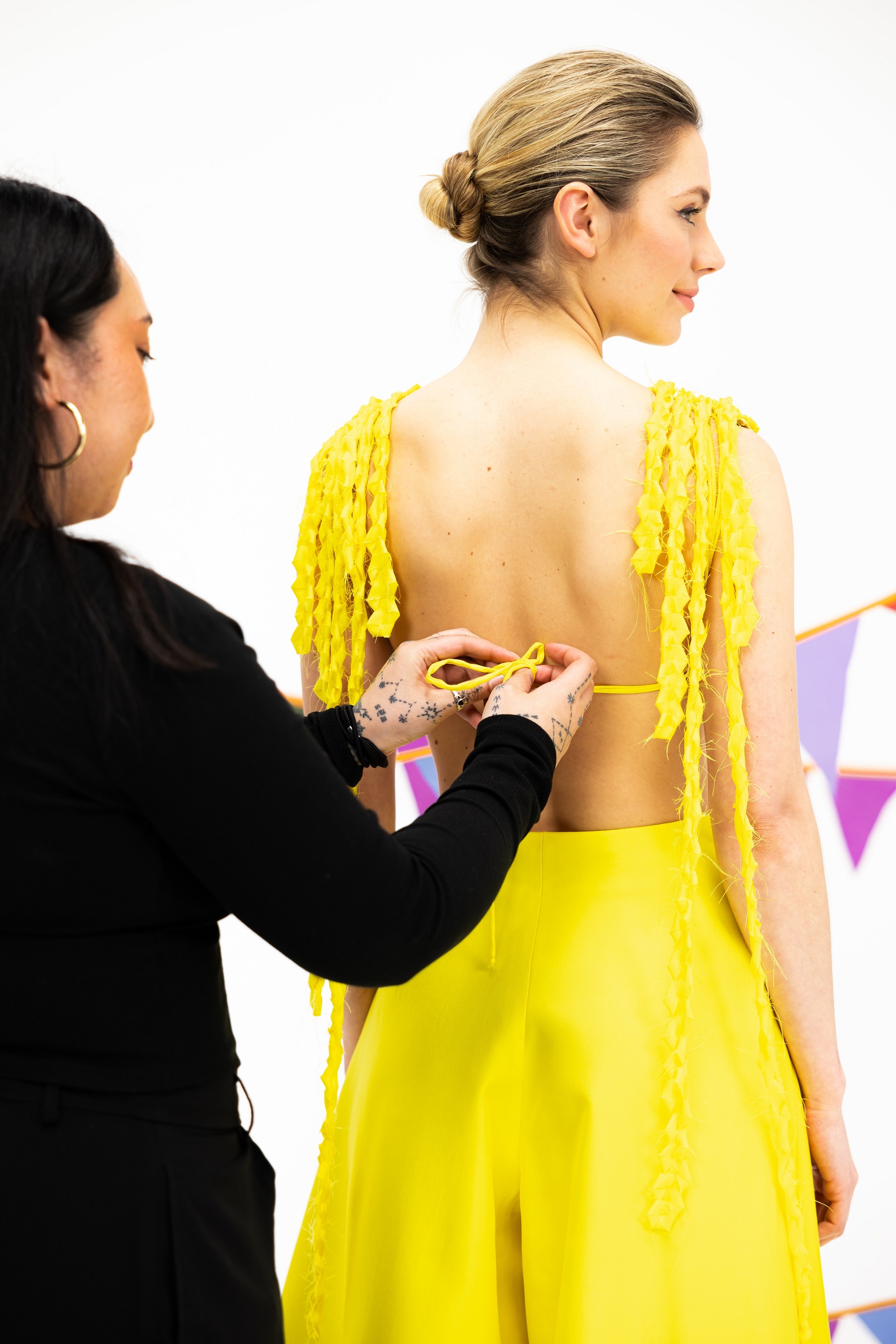 The tendrils on the back of the dress represent the waterfalls of Samoa.