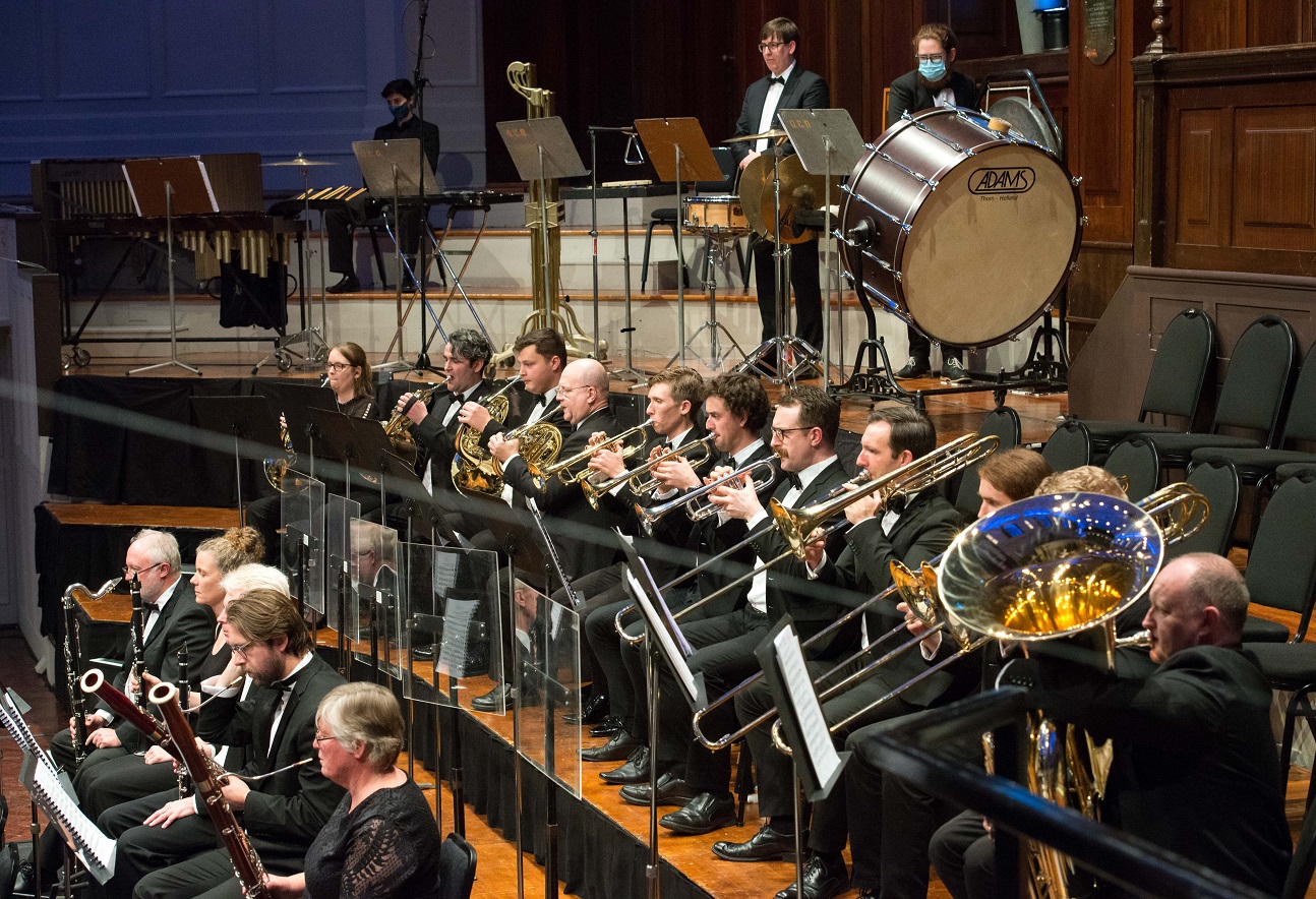 Ralph Miller (seventh from left) plays in the brass section of the Dunedin Symphony Orchestra for...
