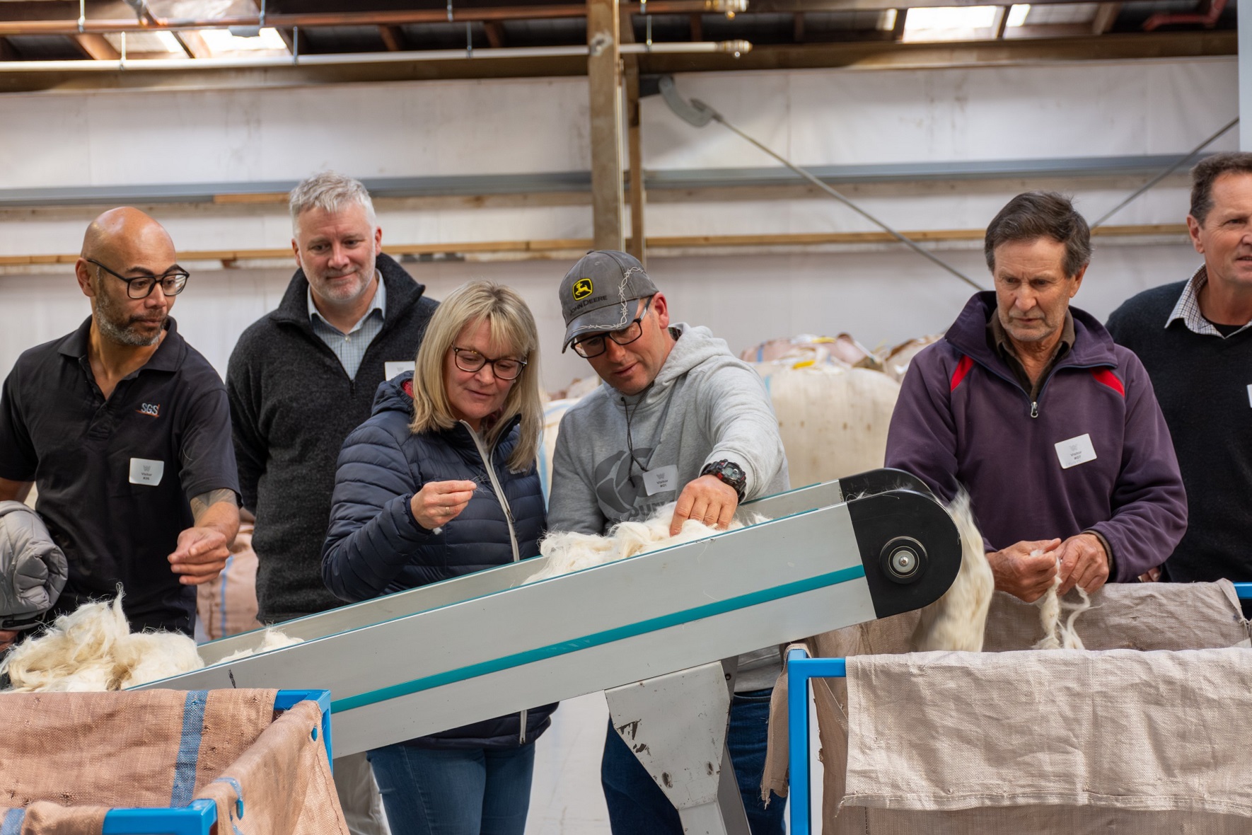 Inspecting cashmere fibre during a recent conference in Wellington are (from left) SGS production...
