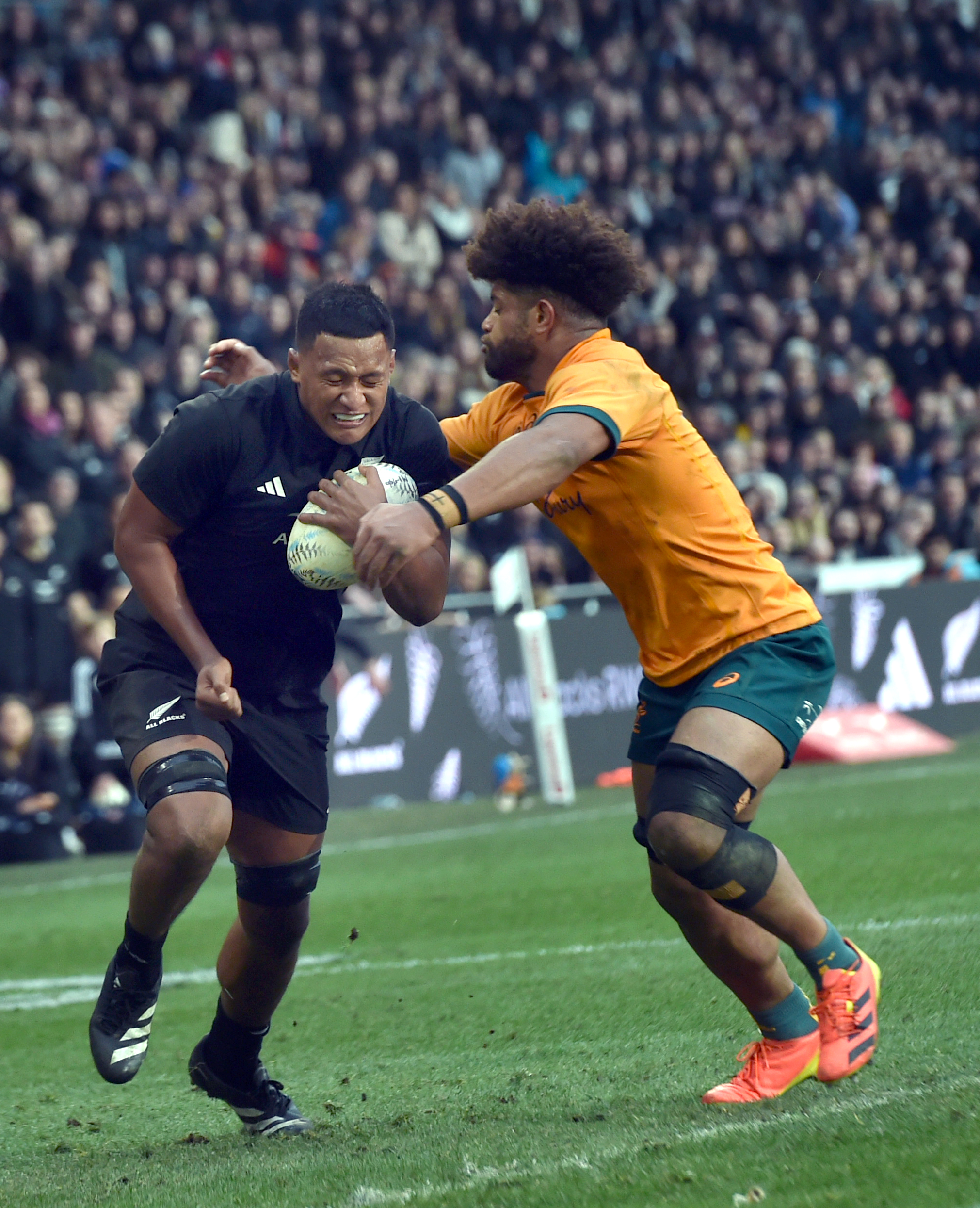All Black debutant Samipeni Finau tries to evade a tackle from Wallaby Rob Valetini. PHOTO PETER...