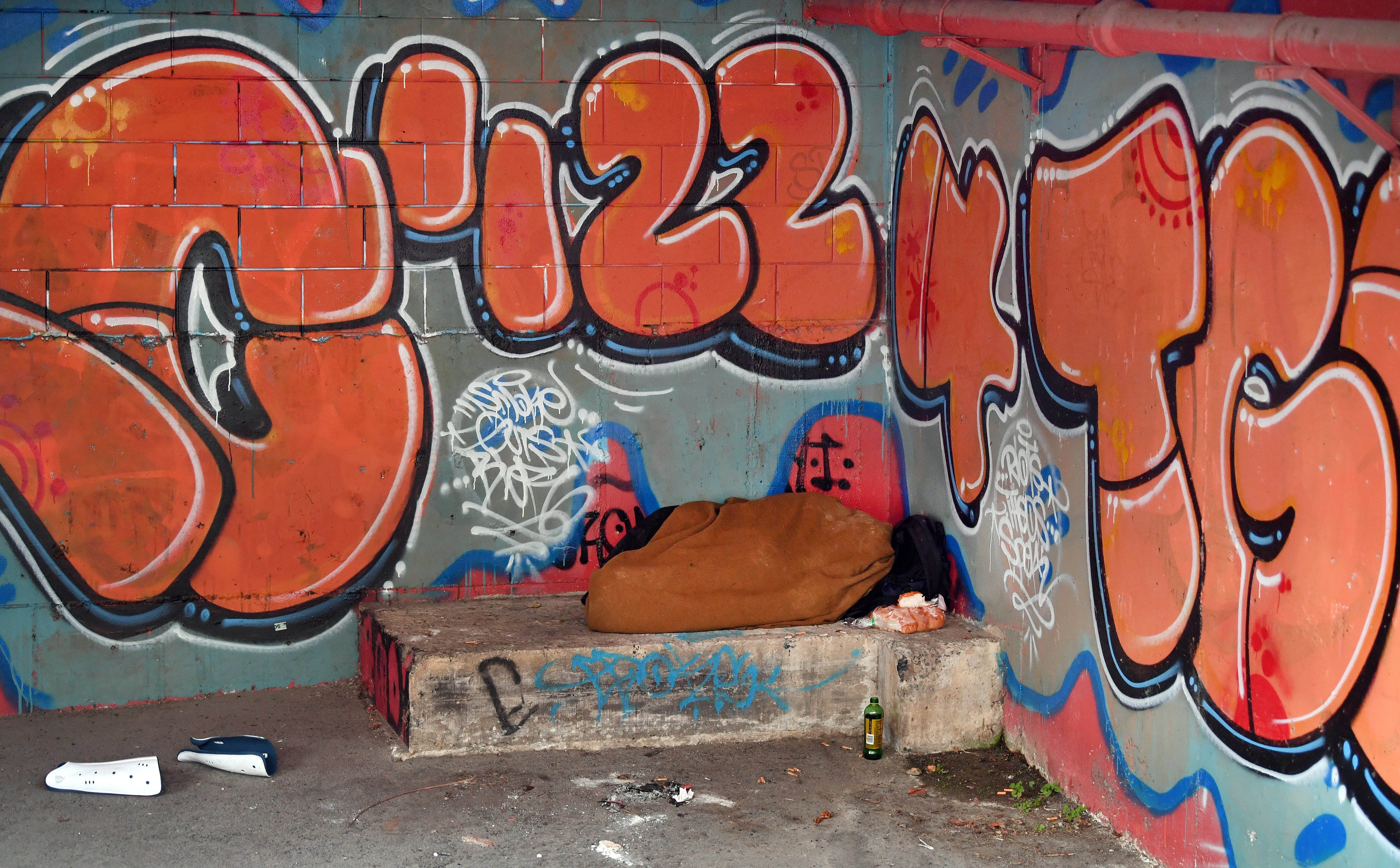 A homeless person sleeps in the basement of the Kaianga Ora building in Moray Place. PHOTO:...