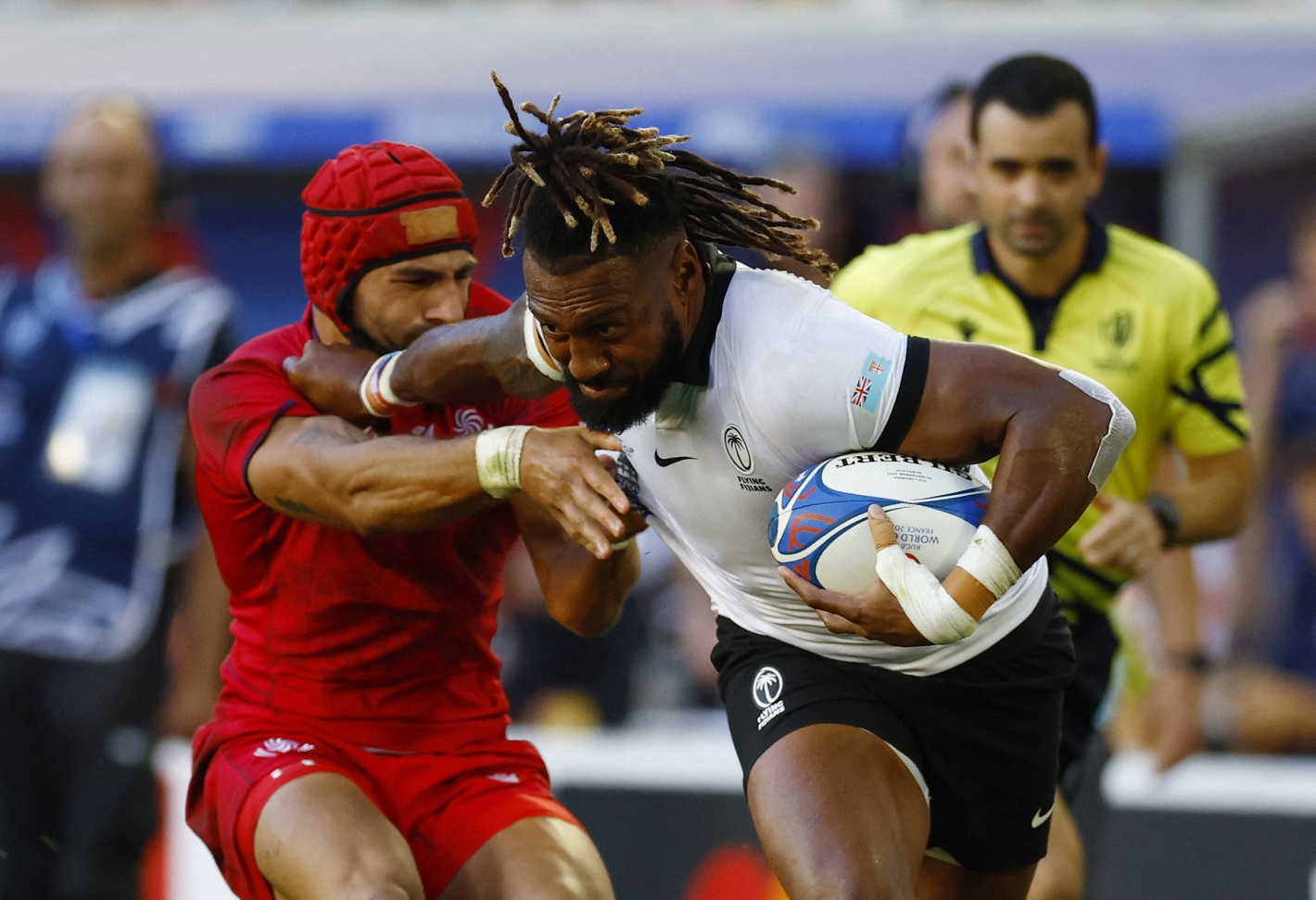Fiji's Waisea Nayacalevu fends off a Georgian tackler. Photo: Reuters