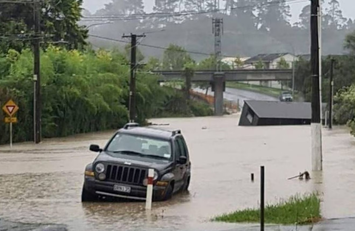 Flooding on Candia Rd in West Auckland's Henderson Valley on January 27. Photo: NZ Herald 