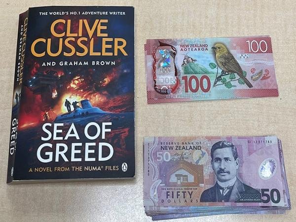 The book Sea Of Greed was used to hide cash, in a scam which nearly caught out a Gore man. Photo:...