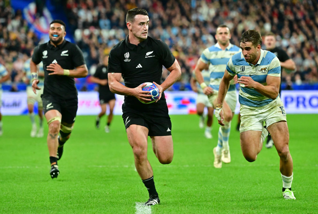 All Black wing Will Jordan steams past Argentina's Juan Cruz Mallia  during their Rugby World Cup...