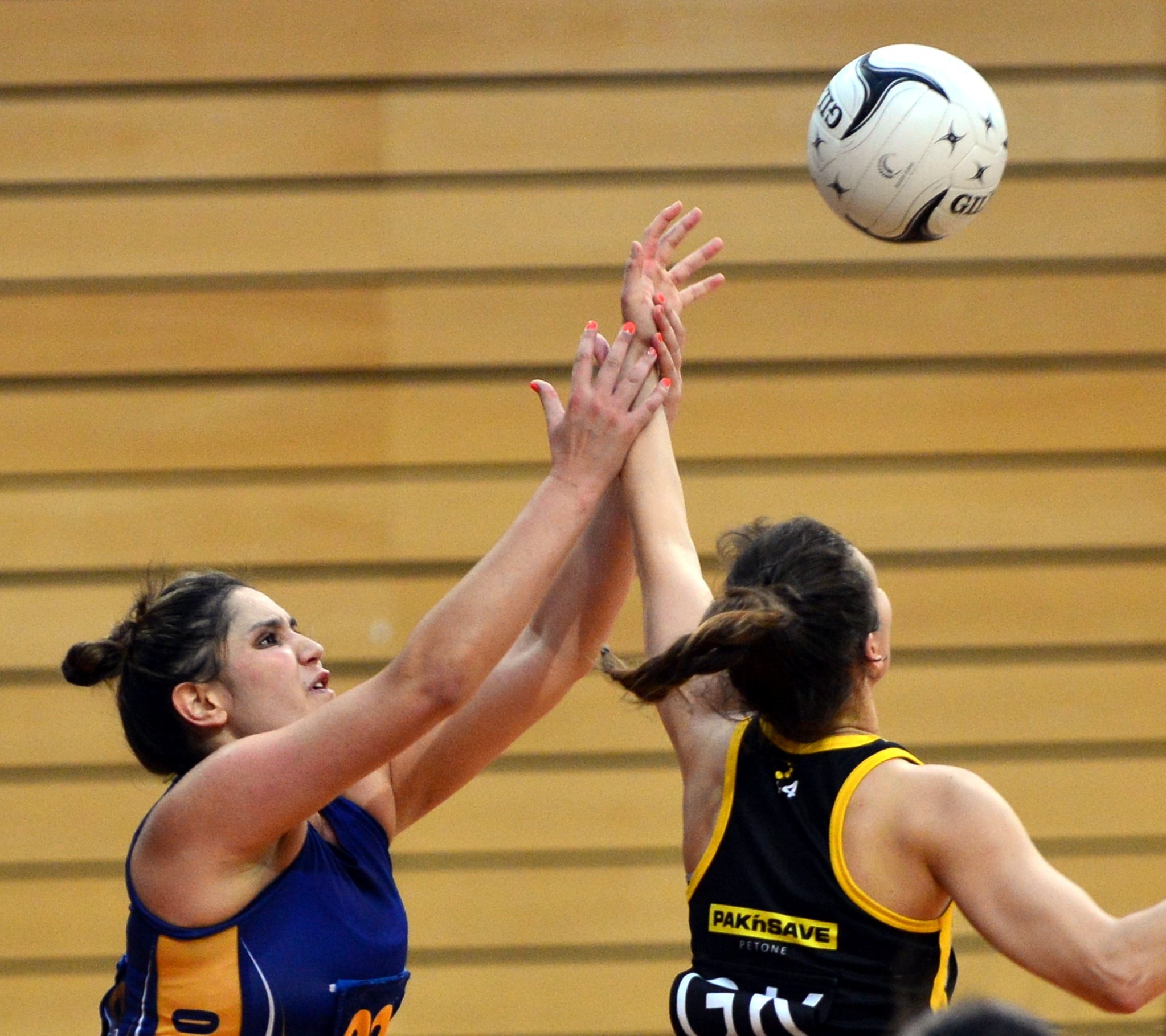 Otago goal shoot Te Paea Selby-Rickit (left) competes with Wellington goal keep Karin Burger...