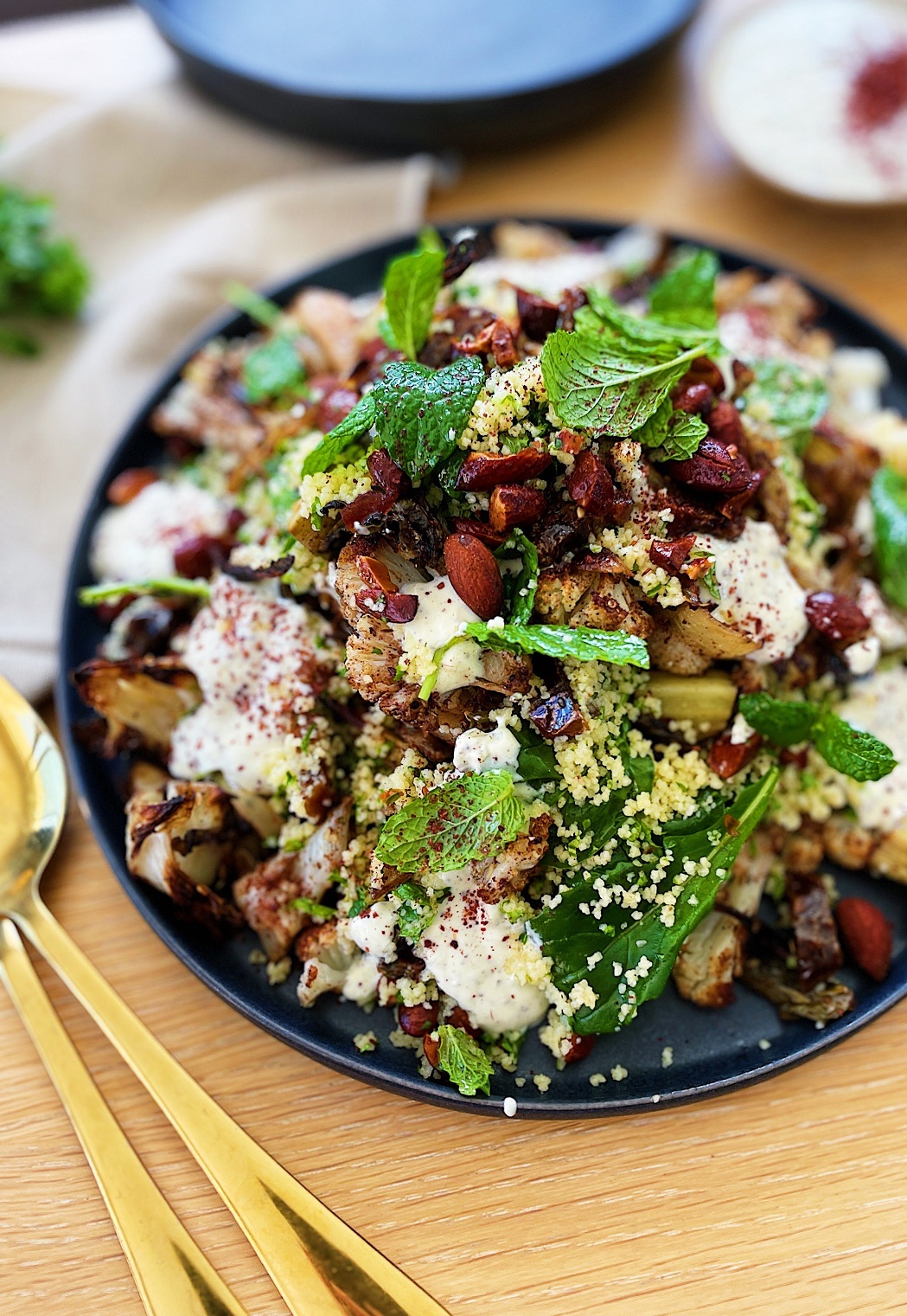 Za’atar roasted cauliflower and couscous salad with dates, almonds and sumac yoghurt. PHOTOS:...