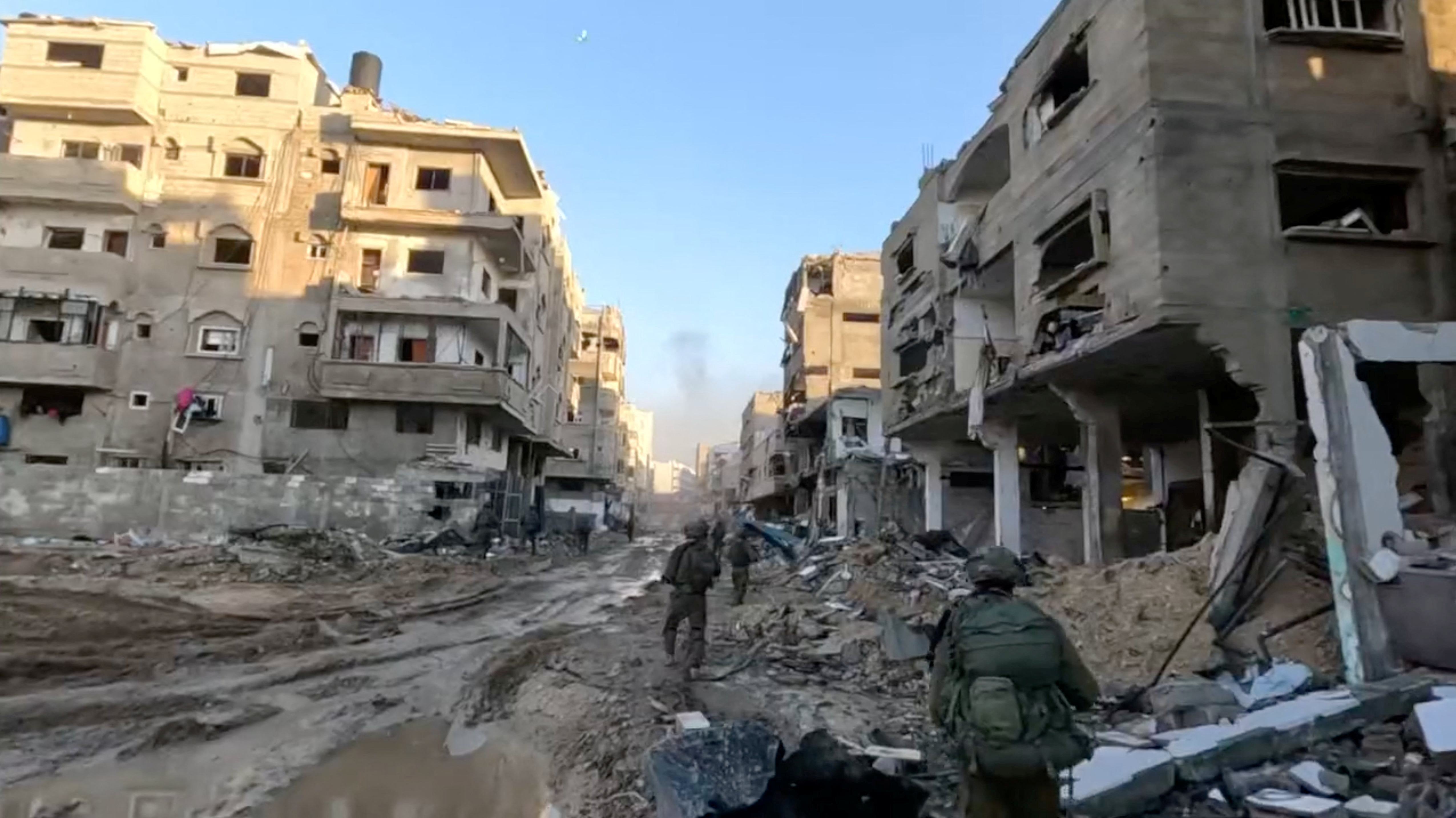Israeli soldiers move through part of the Gaza Strip on Friday. Israel Defence Forces/Handout via...
