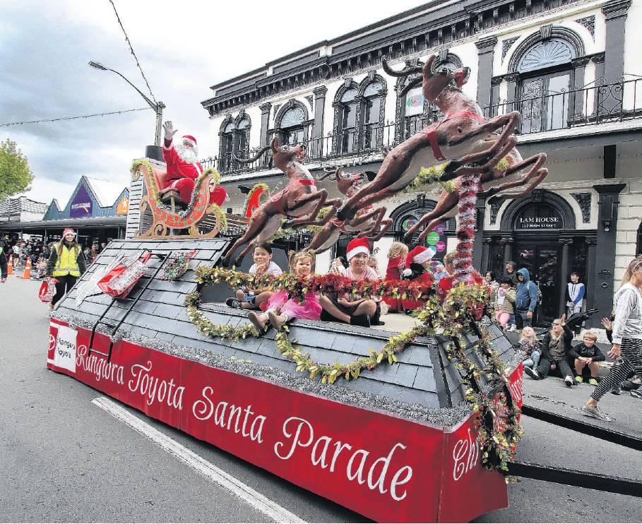 Santa arrives atop his sleigh. Photo: John Cosgrove
