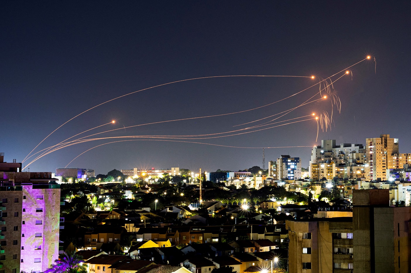 Israel's Iron Dome anti-missile system intercepts rockets launched from the Gaza Strip, as seen...