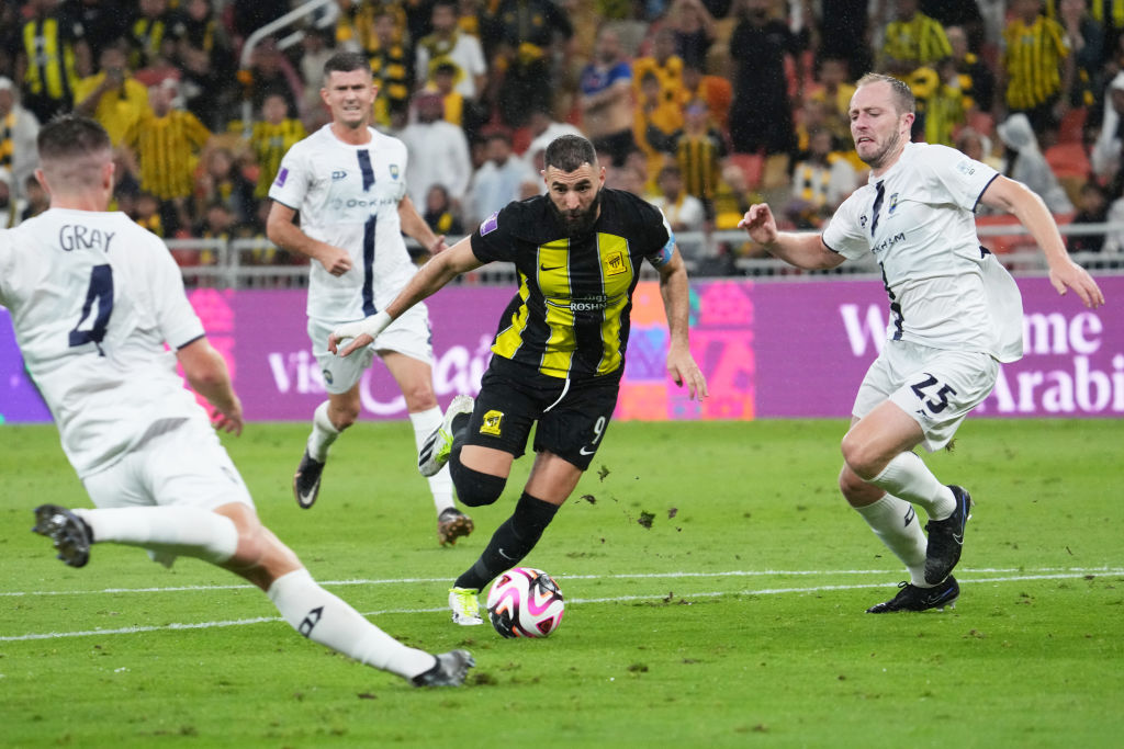 Karim Benzema of Al Ittihad is challenged by Auckland City players during their match in Jeddah....