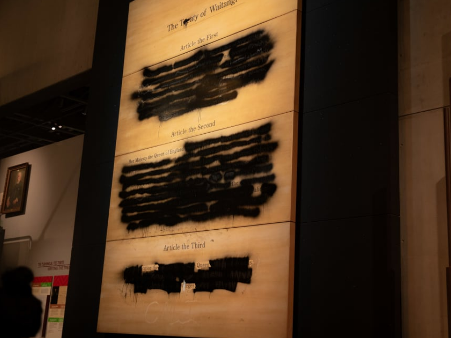 A wooden display panel showing an English version of the Treaty of Waitangi was damaged with...