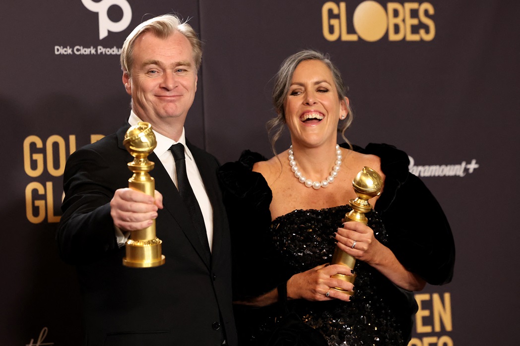 Christopher Nolan and Emma Thomas pose with the awards for Best Director and Best Motion Picture ...
