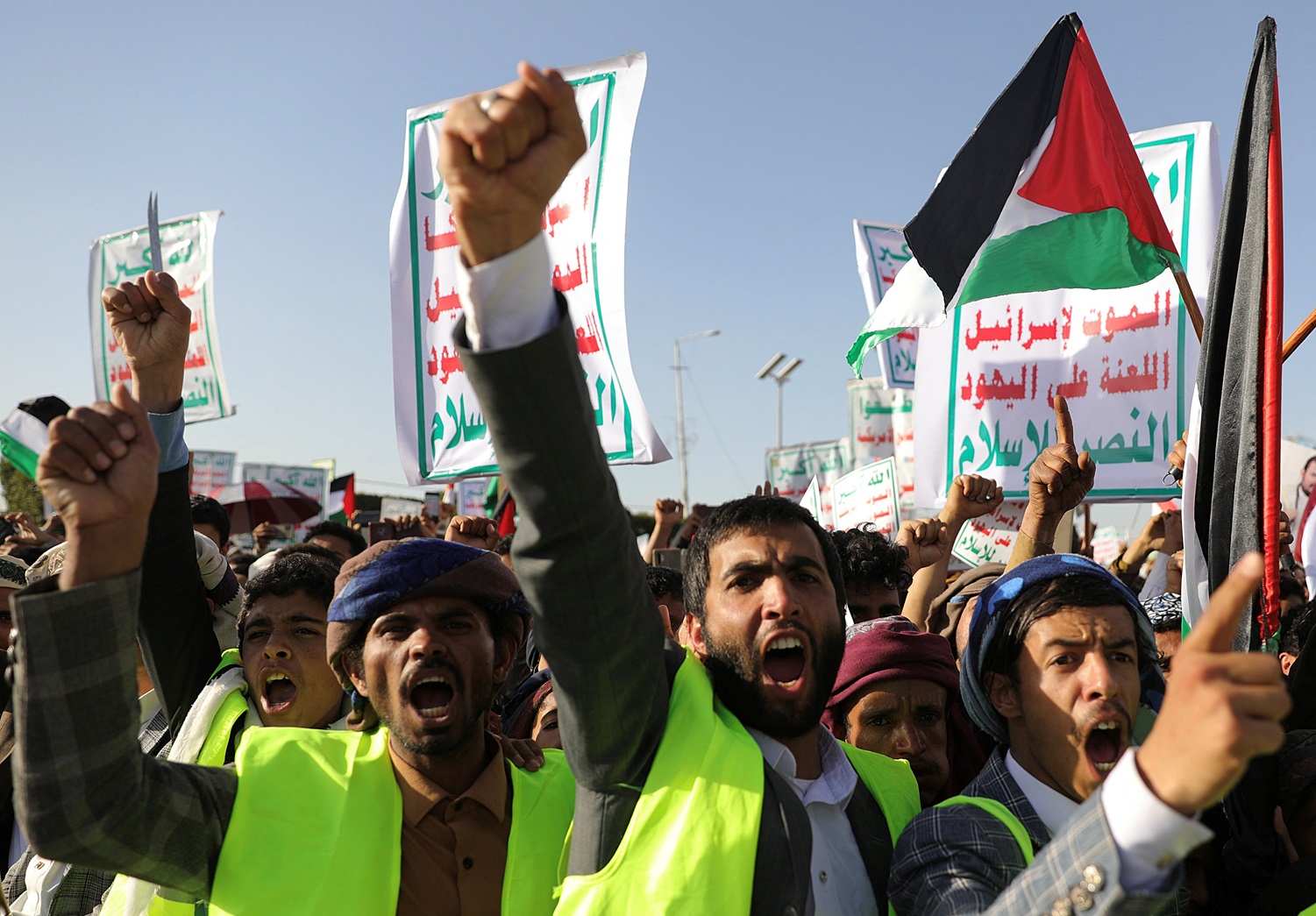 Supporters rally in Sanaa, Yemen to denounce air strikes launched by the US and Britain on Houthi...