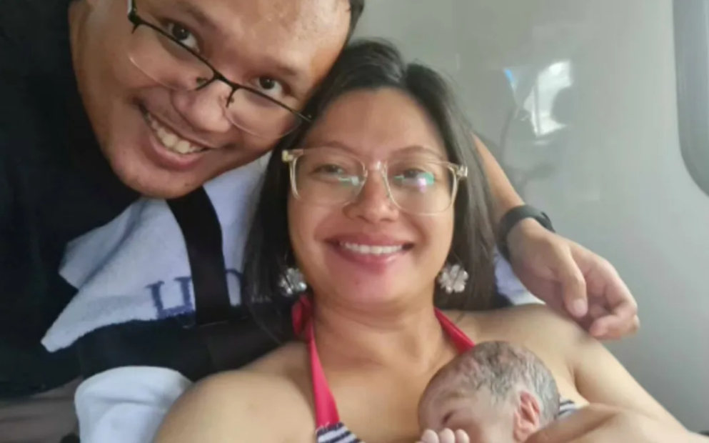 New parents Keith and Gill Ba with son Nathanael were taken to Waitākere Hospital in an ambulance...