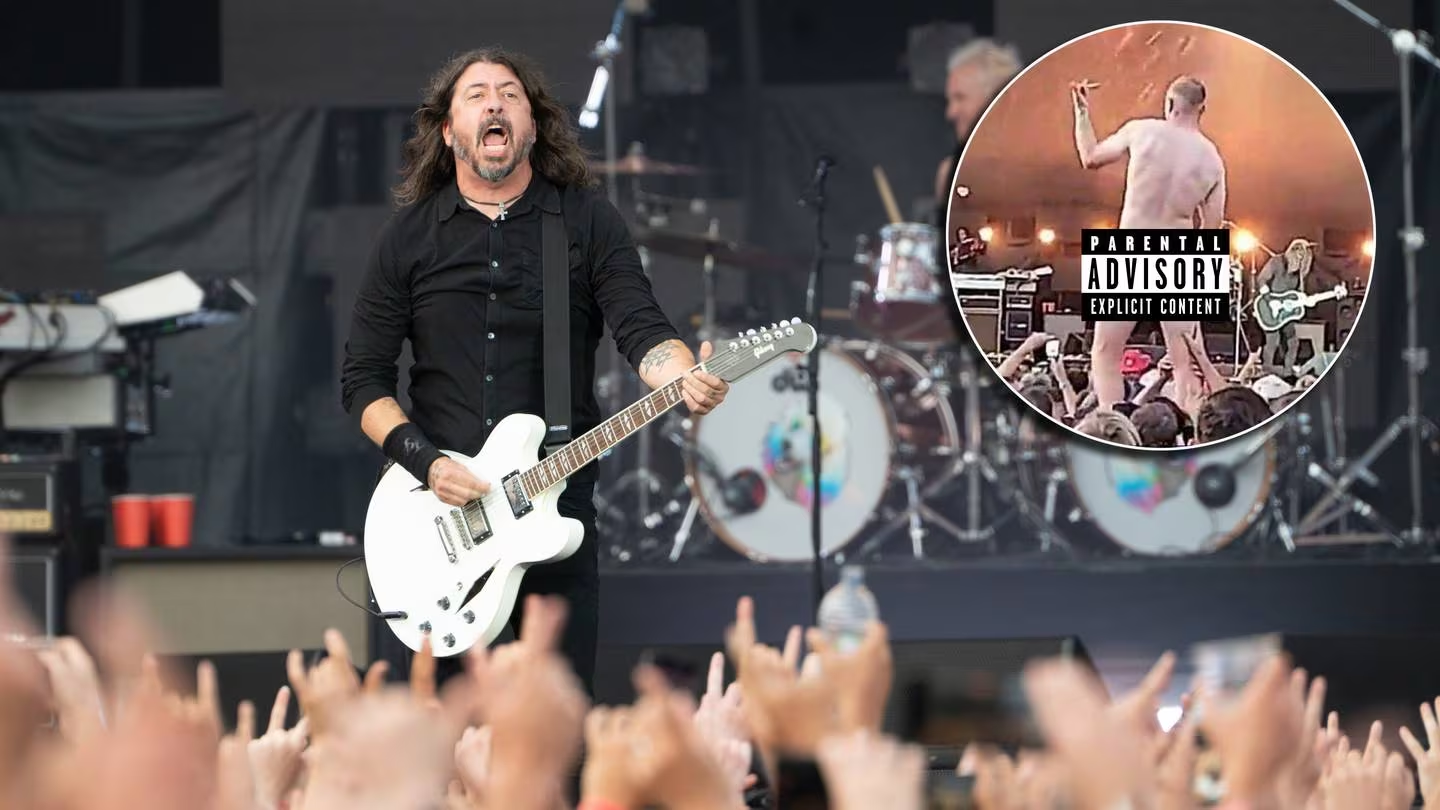 As the Foo Fighters performed in Christchurch, a man stripped fully nude.