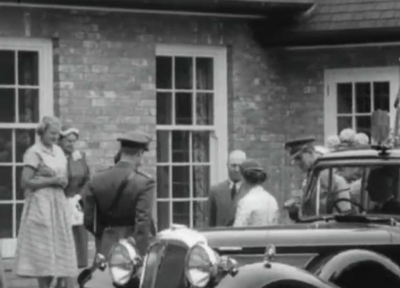 Virginia Thomas (nee Grigg) standing to the far left as her parents welcome the royal couple to...