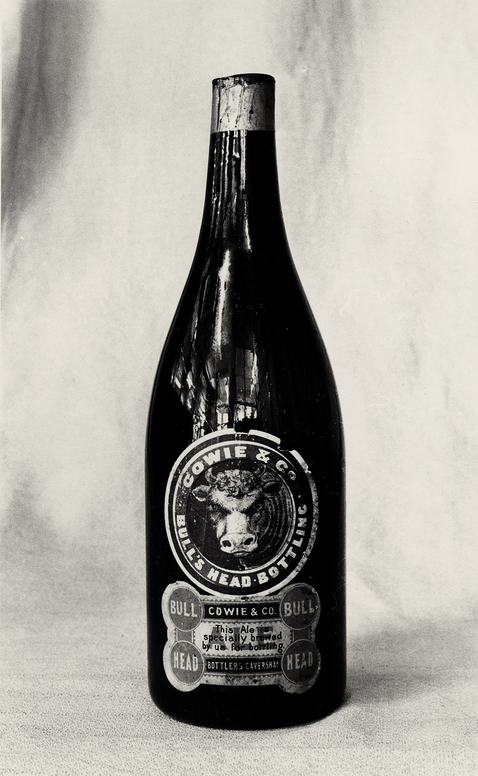 Cowie & Co bottle, date unknown. Photographer unknown, from file copy print 80/1441, Hocken...