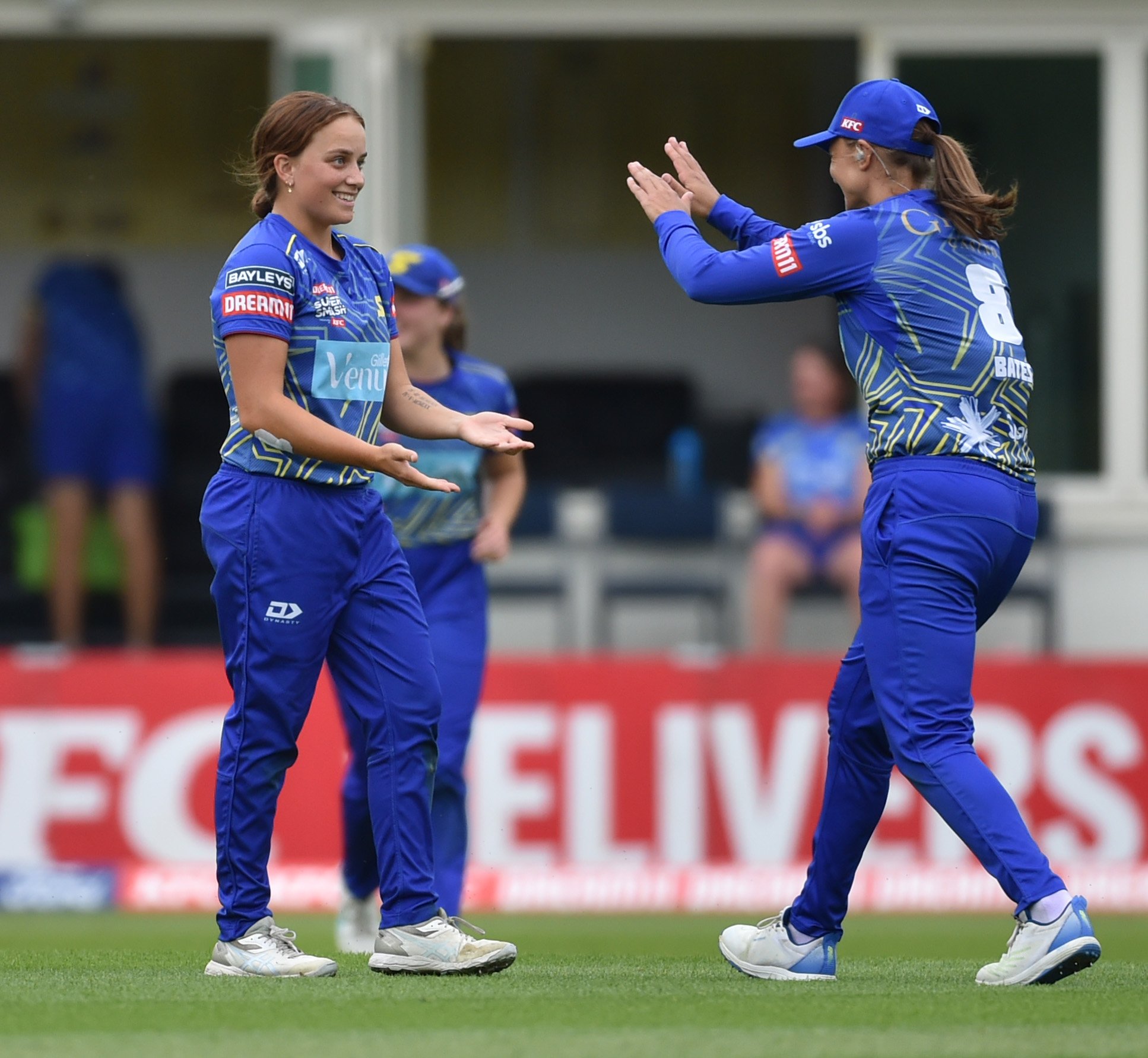 The Sparks’  Eden Carson is congratulated by Suzie Bates after taking a wicket. Photos: Gregor...