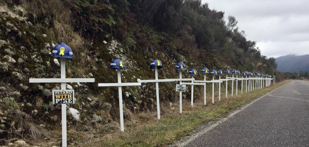 White crosses line the road to the Pike River Mine in tribute to the 29 workers who died in a...