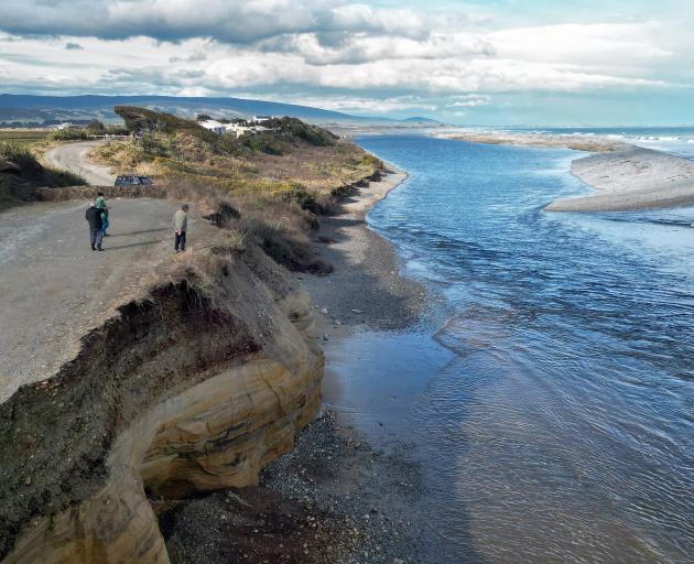 A road in the area being eroded, as seen in a photo from last year. File photo