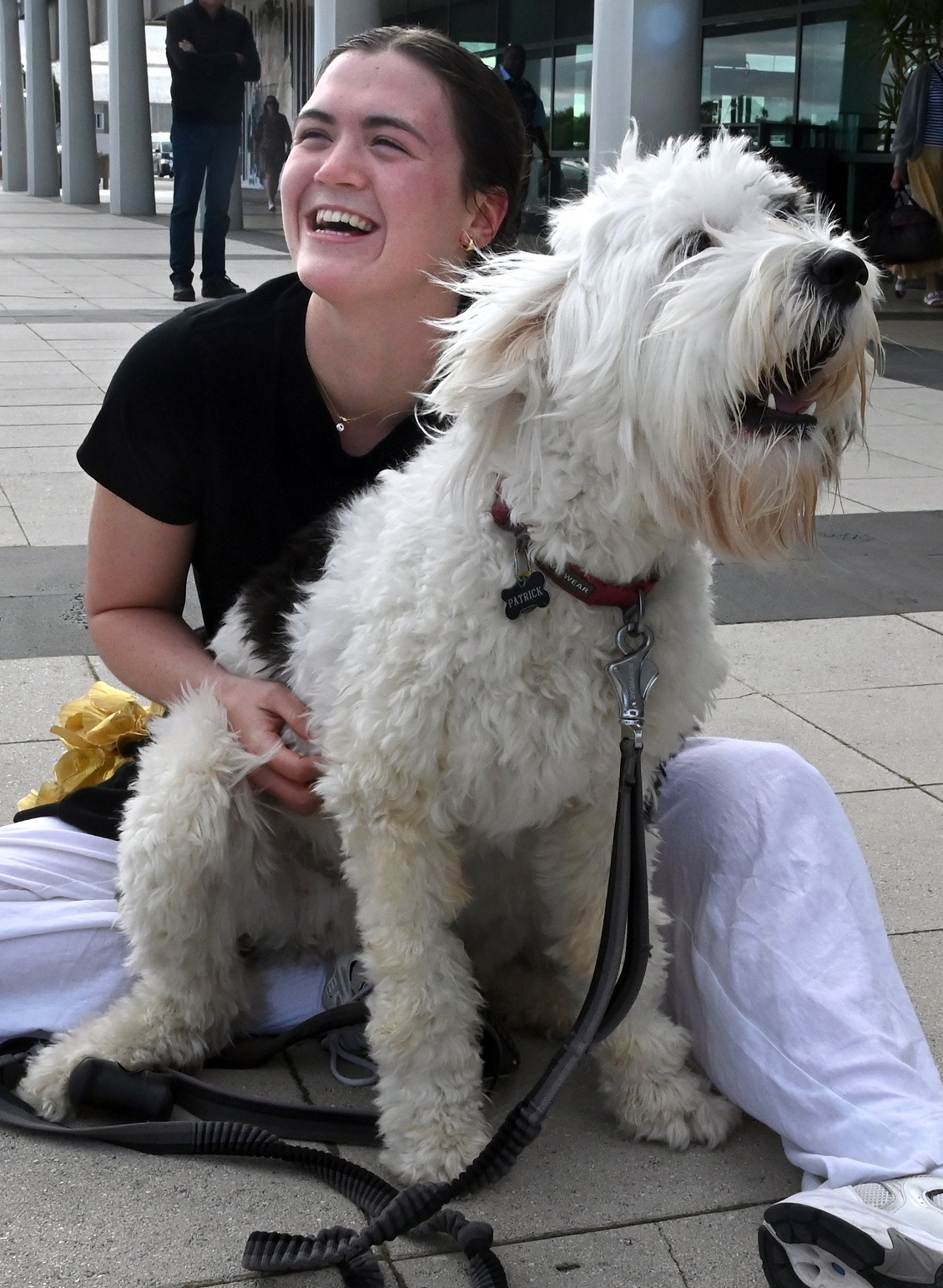 Dunedin world champion swimmer Erika Fairweather celebrates being reunited with her bearded...