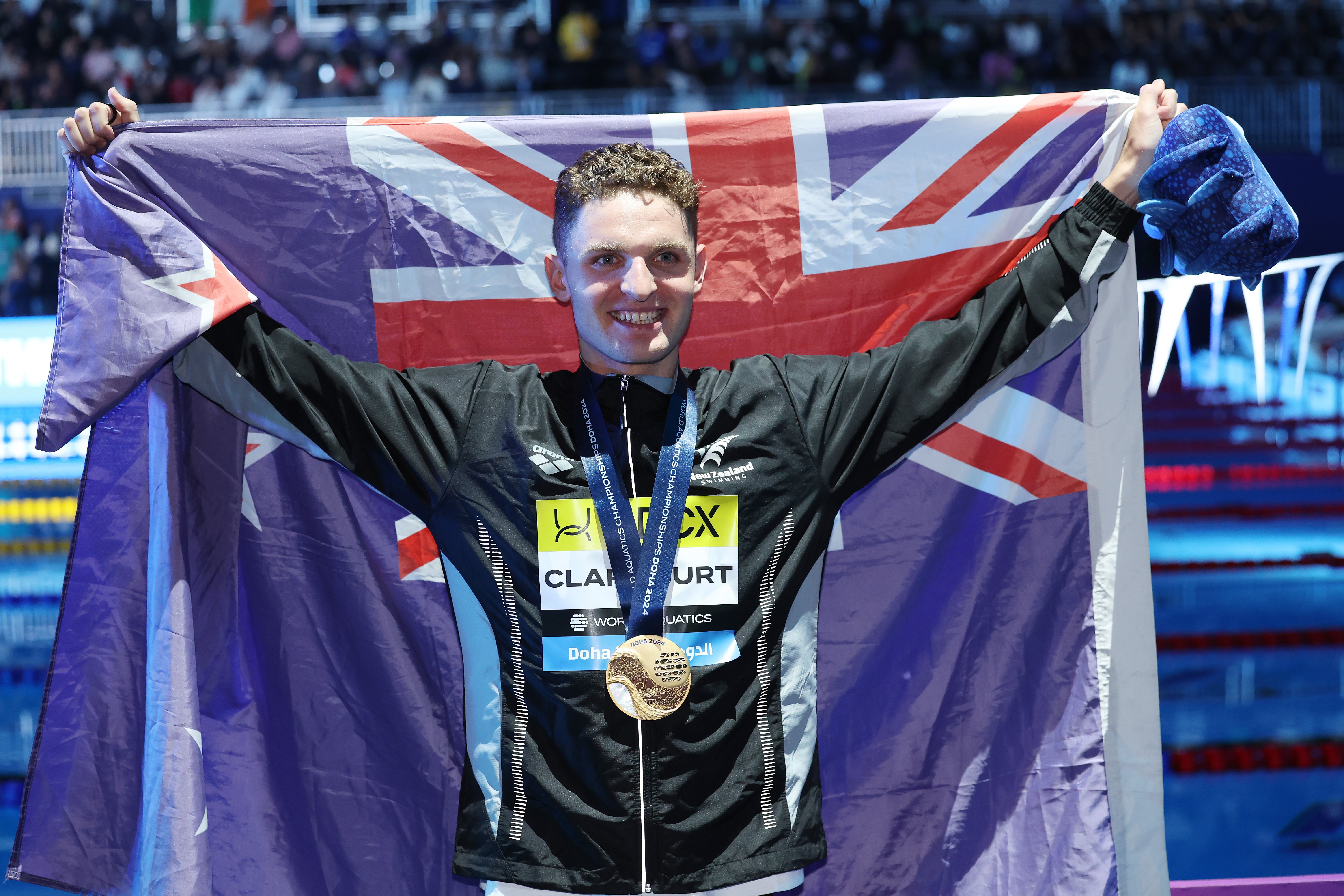 New Zealander Lewis Clareburt celebrates after his win in the 400m individual medley at the World...