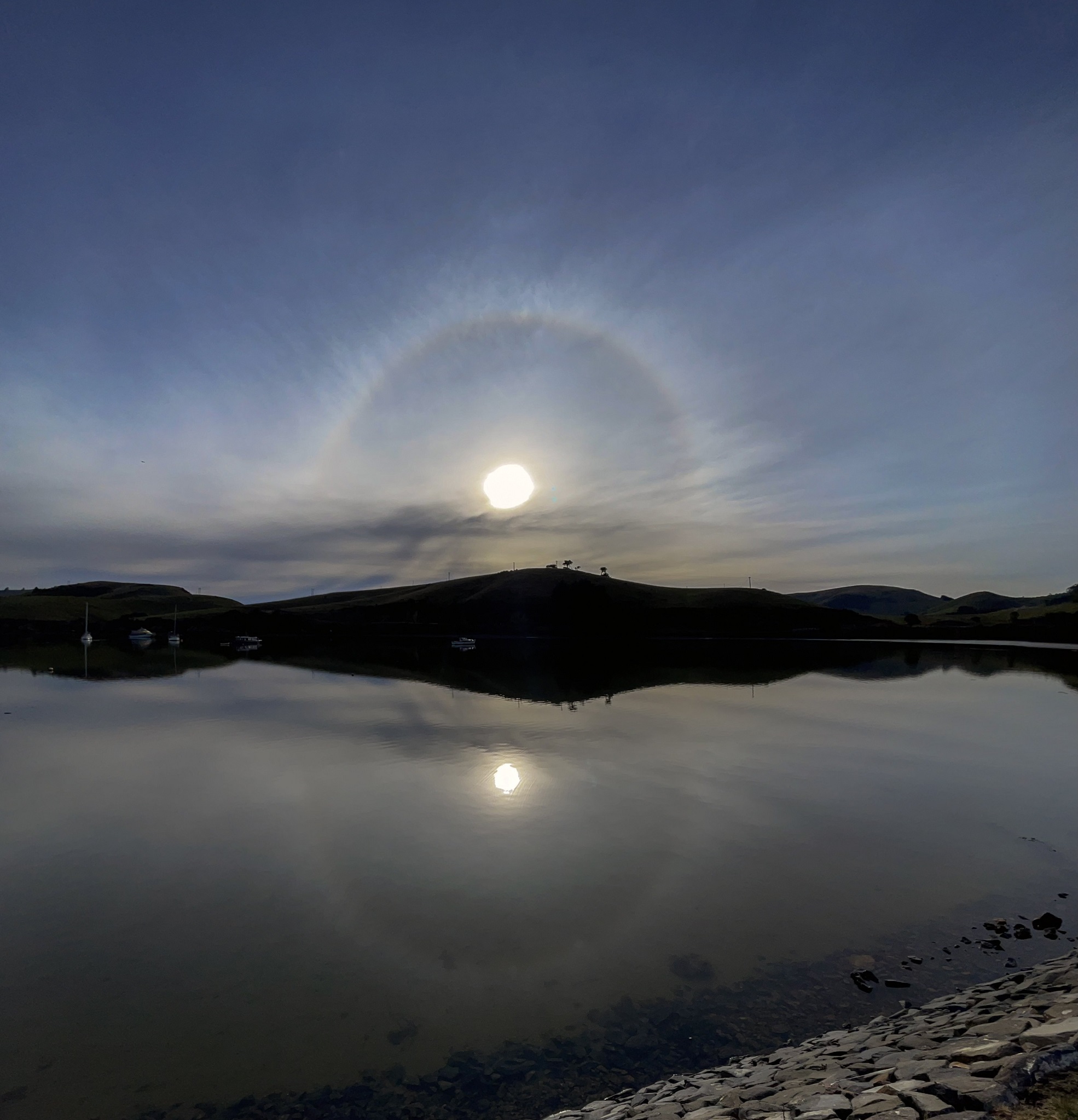 The 22° halo is reflected in the water at Portobello. Photo: Ian Griffin