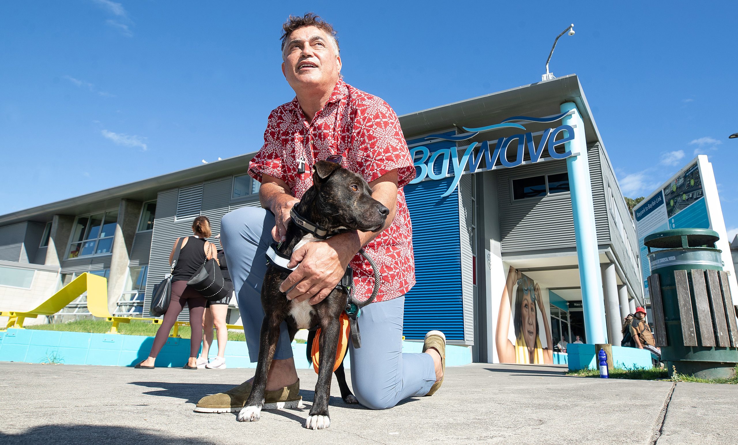 Jarrod Tumai with his dog Poto, who is no longer allowed at council pools. Photo: John Borren...