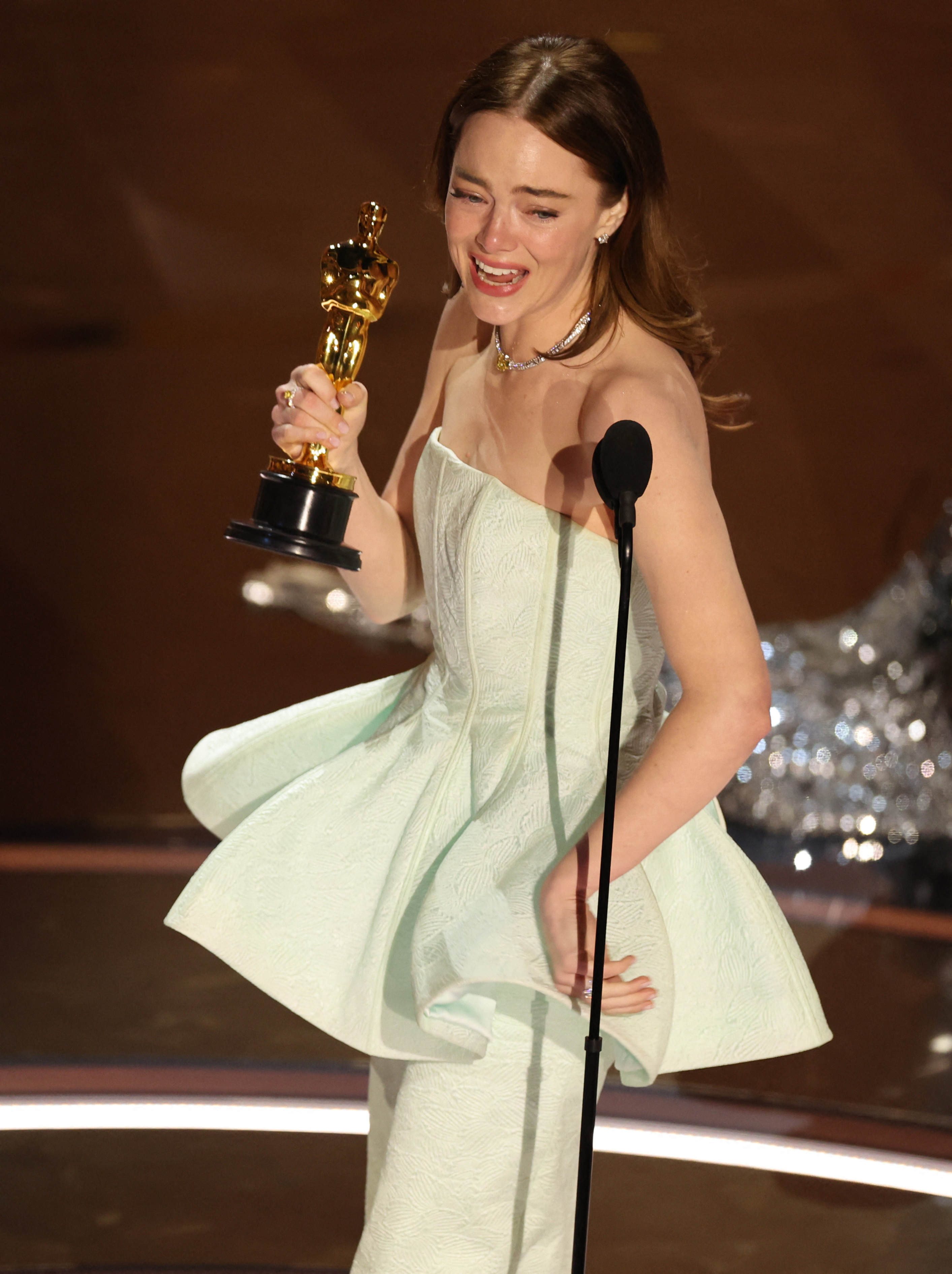 An emotional Emma Stone picked up her second best actress Oscar. Photo: Reuters 