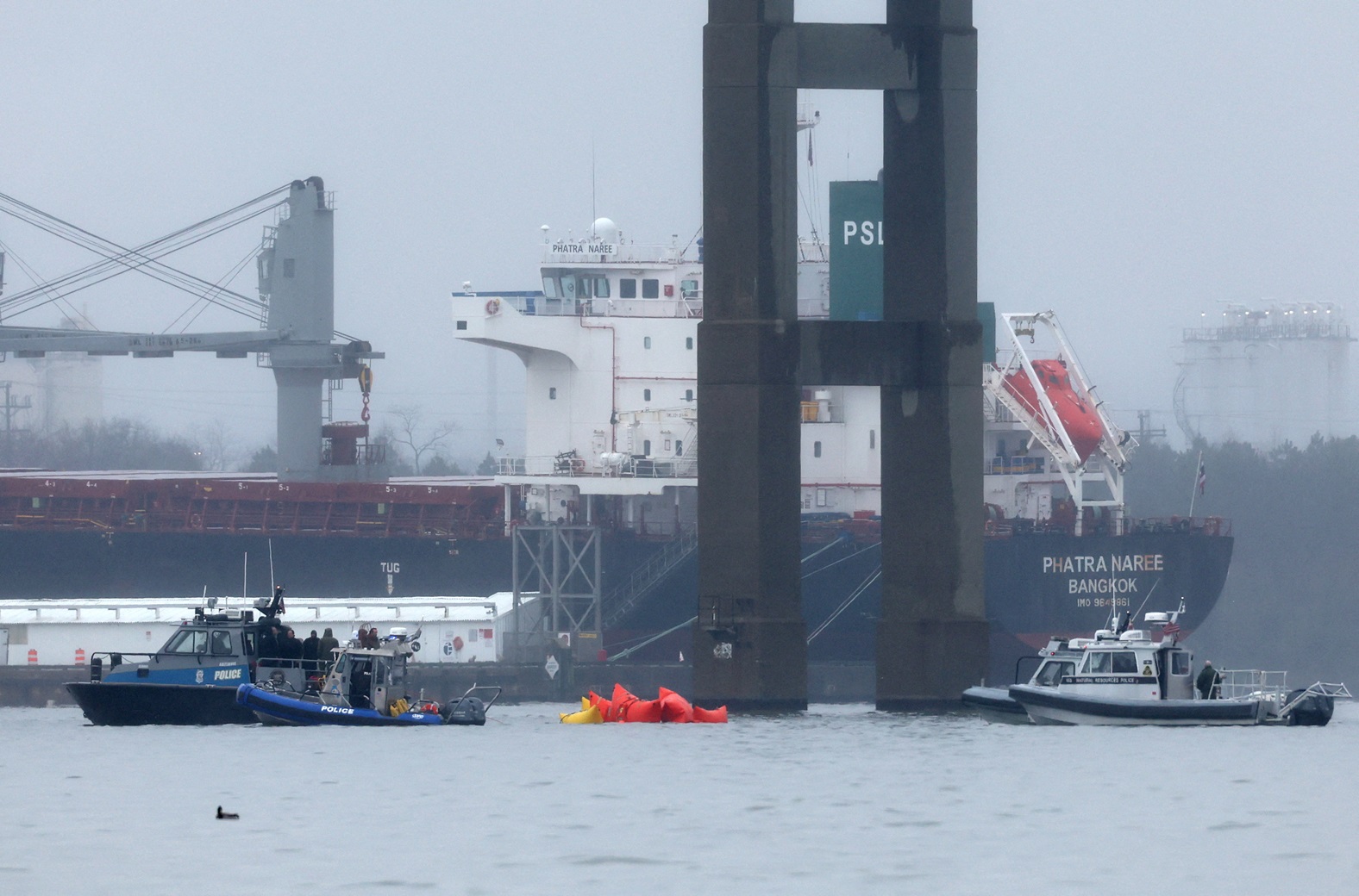 Emergency dive teams work at the scene of the collapsed bridge in Baltimore Harbor. Photo: Reuters