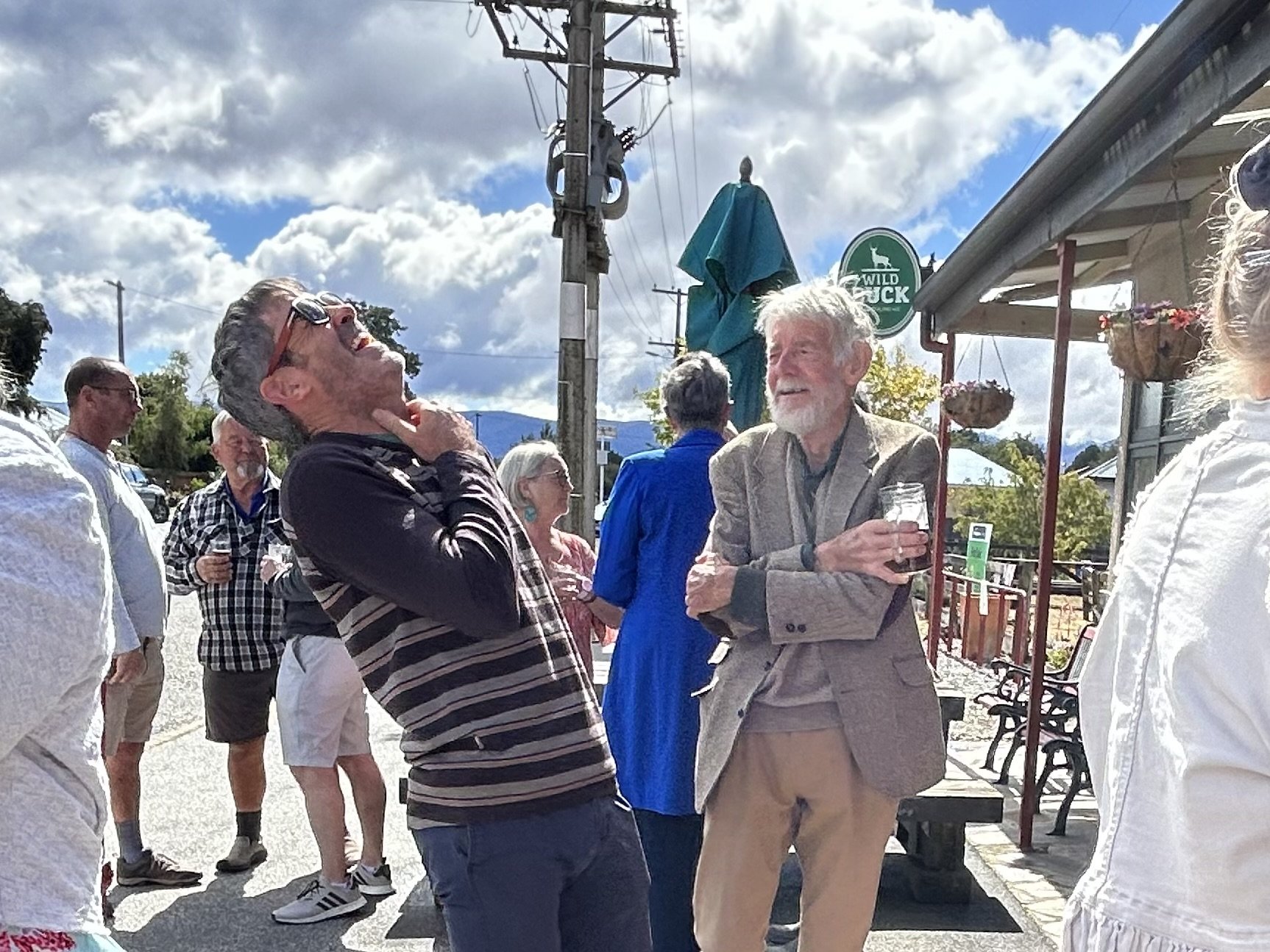 Former professional road cycling champion Julian Dean (left) enjoys a story told by his...