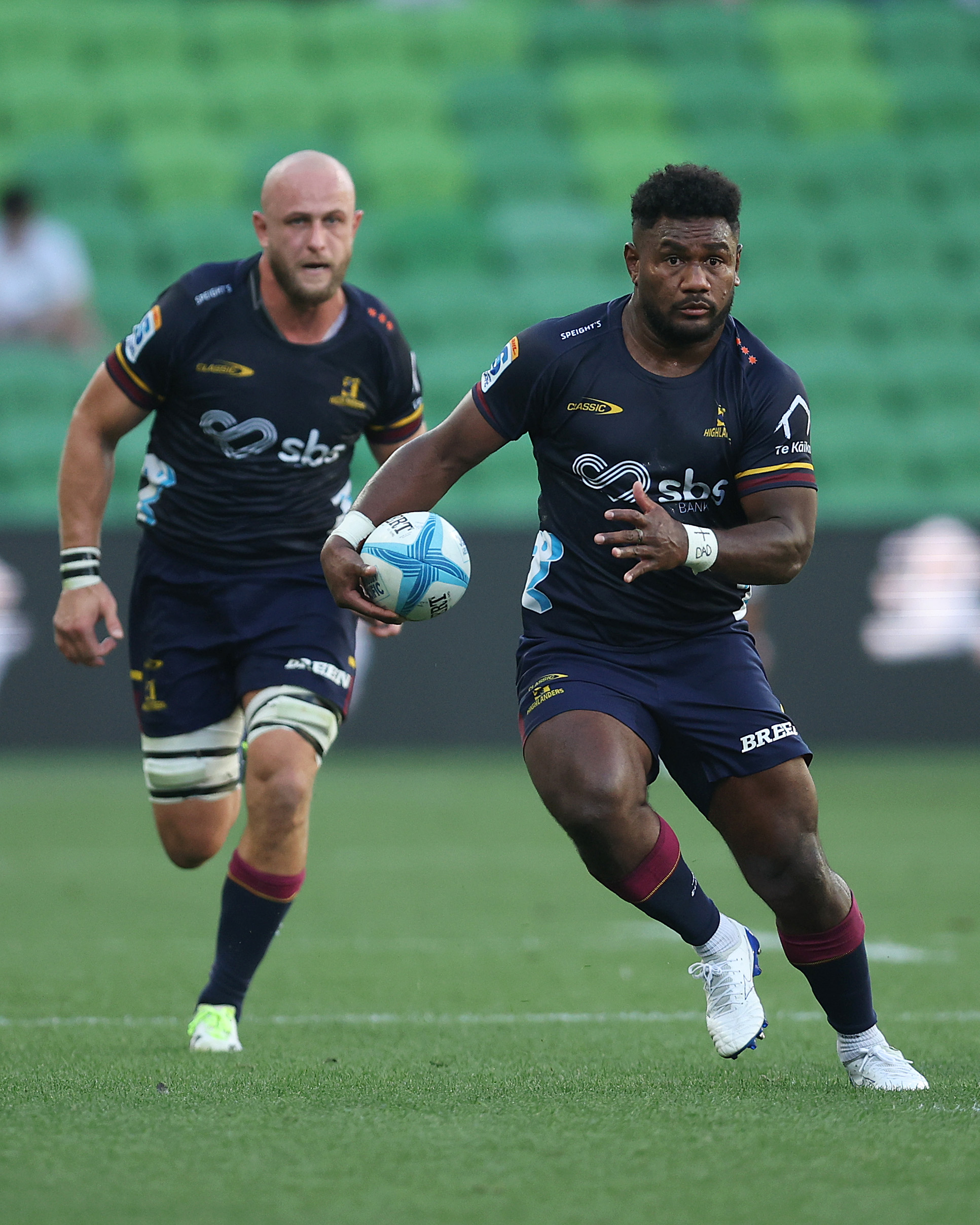 Highlanders winger Timoci Tavatavanawai charges upfield with No 8 Hugh Renton in support during...