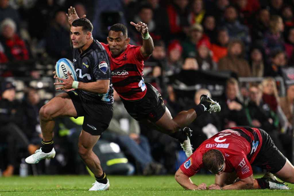Joshua Moorby of the Hurricanes makes a break from Crusader Sevu Reece. Photo: Getty Images 