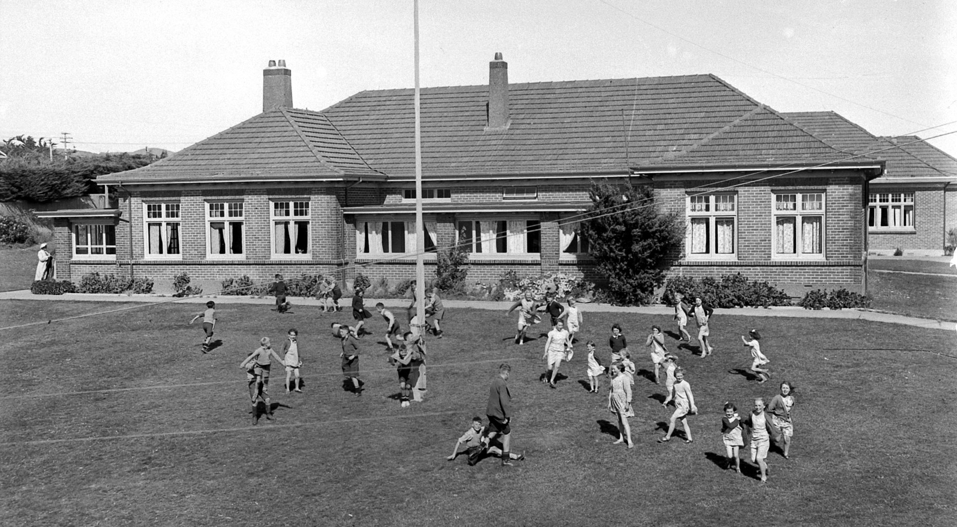 Children play outside Glendining Presbyterian Children’s Homes, Andersons Bay, in November 1950....