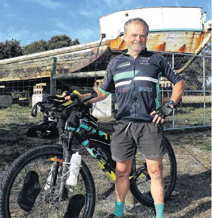 Kaiapoi cyclist Bruce Milsom in front of the benefactor of his fundraising marathon ride - The...