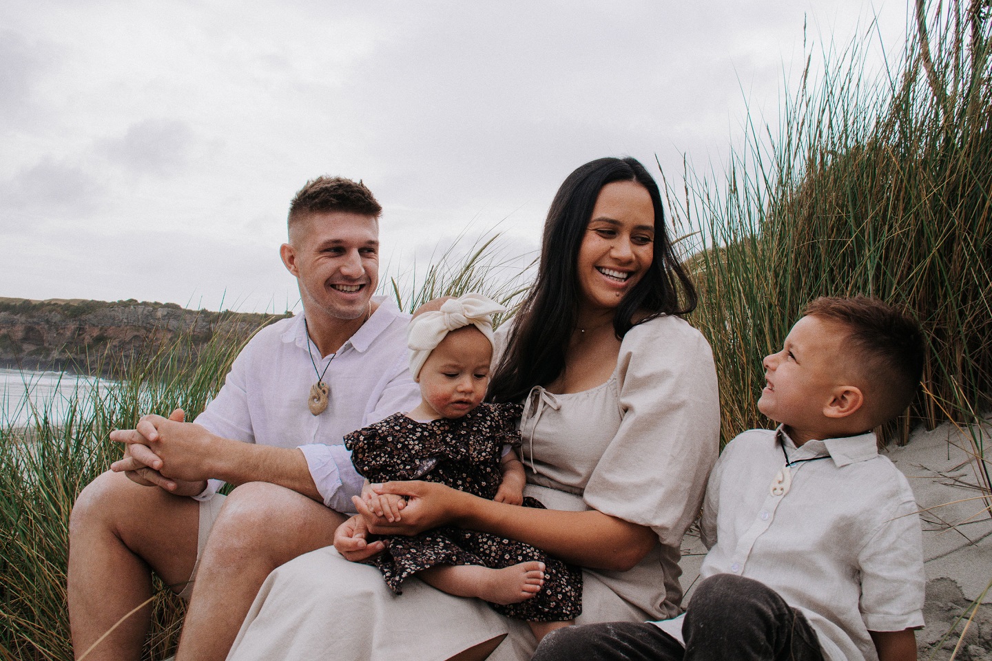 Mrs Lawrie holds her daughter Victoria Lawrie, 1, alongside her partner Samuel Lawrie (Ngāti...