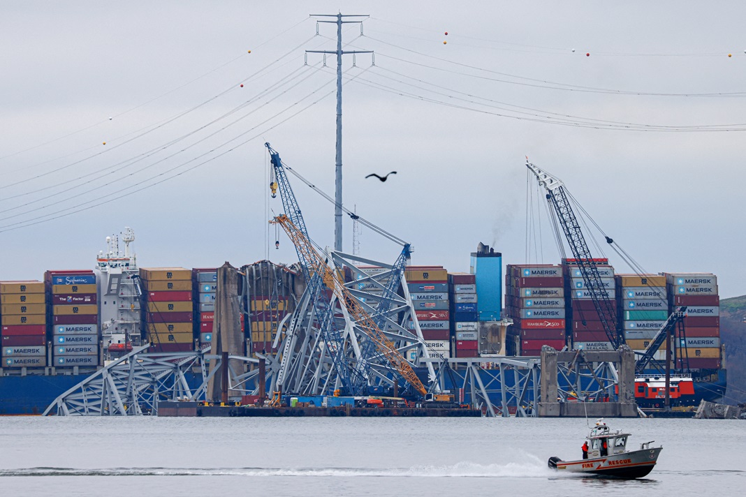 Wreckage of the Francis Scott Key Bridge lies across the deck of the cargo vessel Dali as salvage...