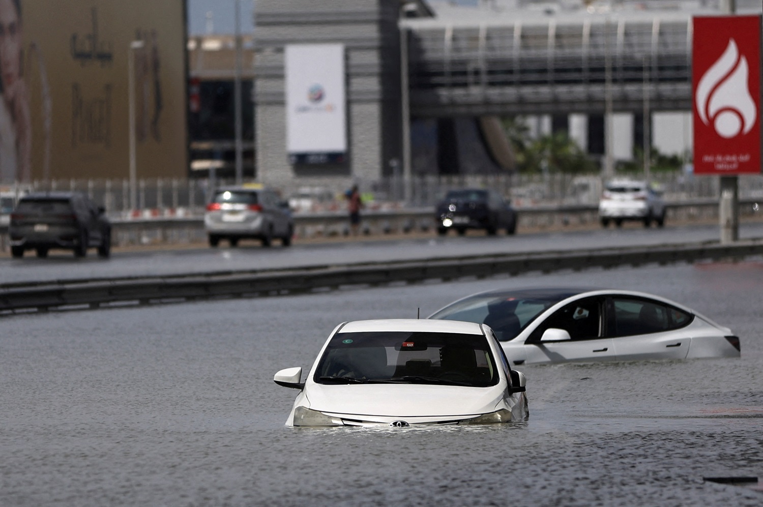 Cars sit stranded in floodwaters caused by heavy rains in Dubai. Photo: Reuters