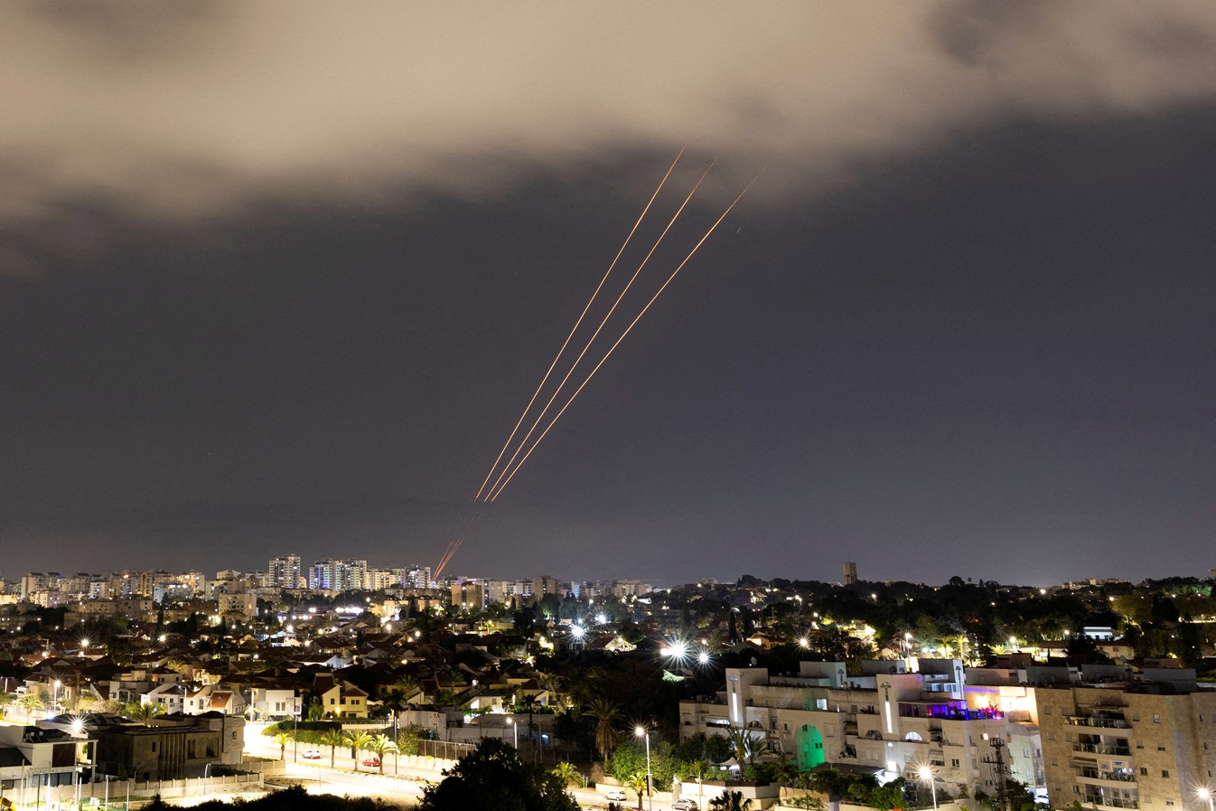 An anti-missile system operates after Iran launched drones and missiles towards Israel earlier...