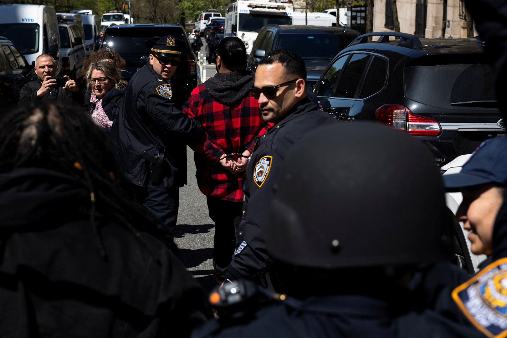 A demonstrator is detained by police officers outside Columbia University's New York City campus....