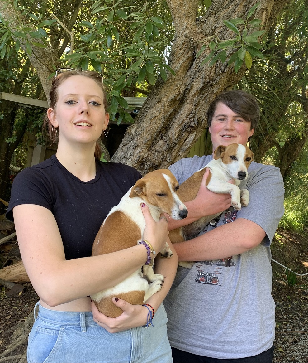 Lucy Jackson, 18 (left), holds Max, and Jamie Hall, 18, holds Jesse — the two dogs missing from...
