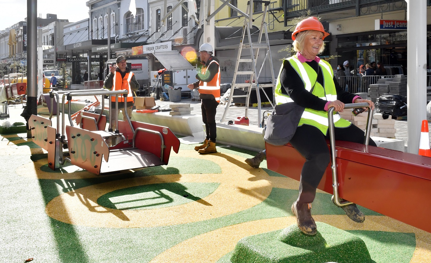 Park Central playground auditor Tina Dyer takes a ride on a new seesaw in George St as part of a...