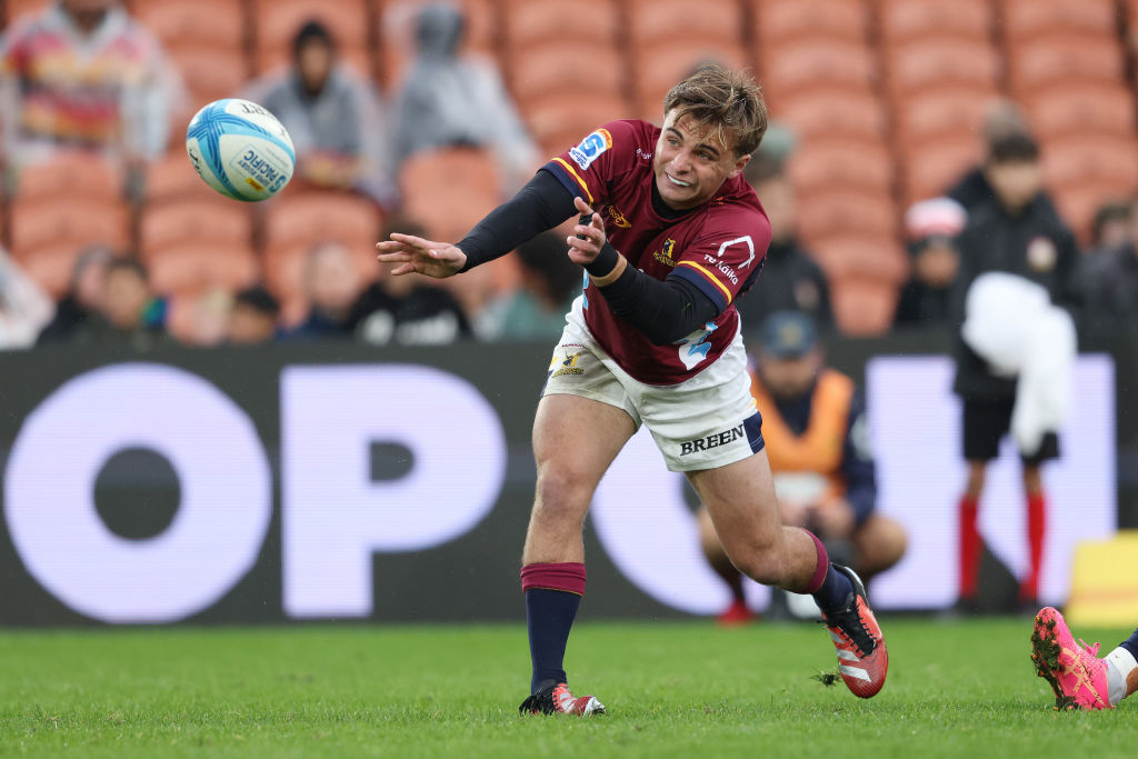 Highlanders halfback James Arscott sends out a pass during the game against the Chiefs in...