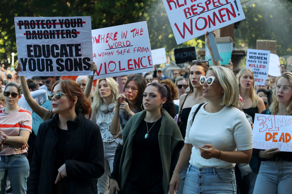 Demonstrators take part in a national rally against violence against women in the Sydney central business district on Saturday. Photo: Getty